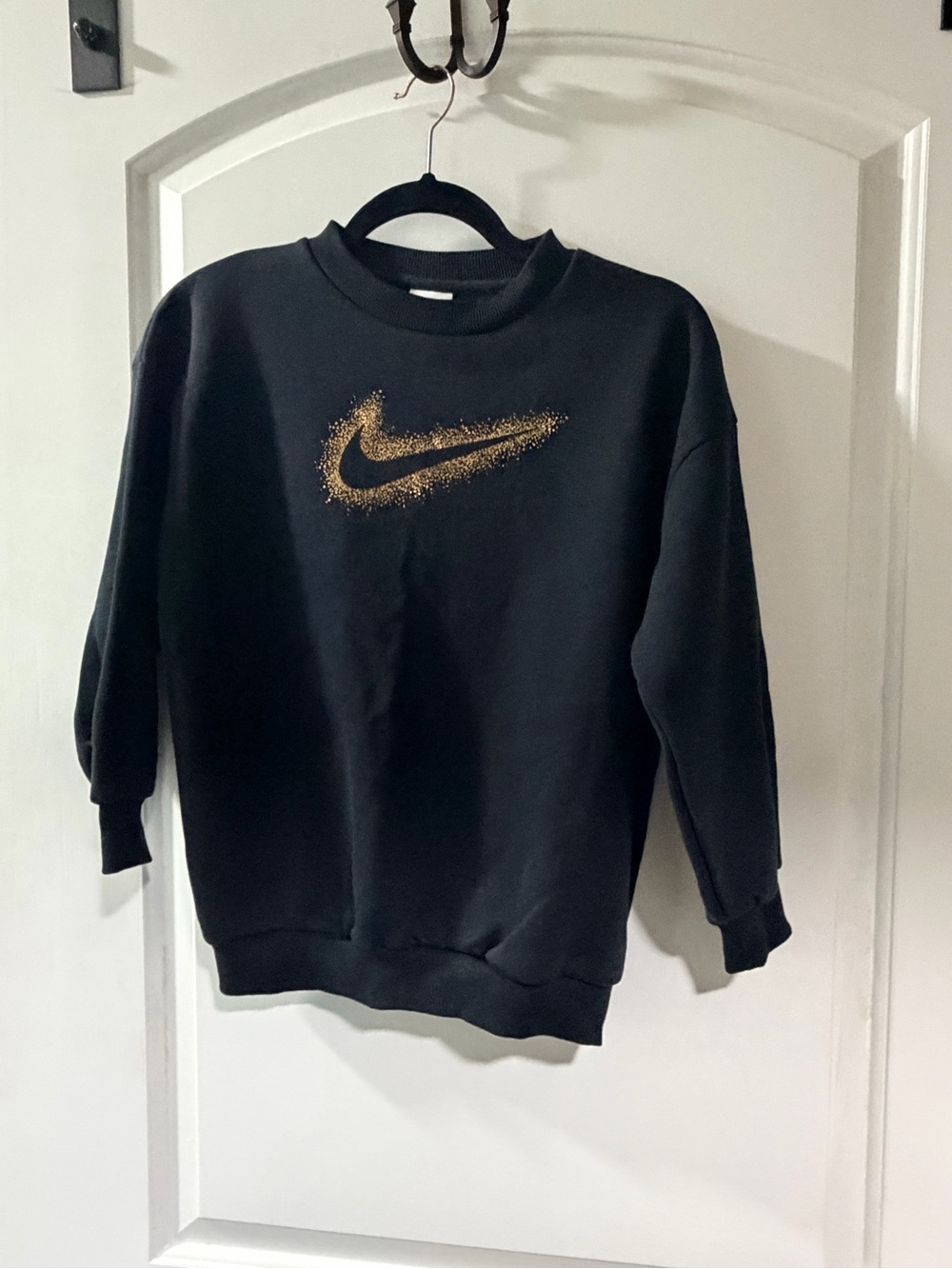 NWT Nike Black Sweatshirt with Gold Speckled Swoosh. Girls Small.